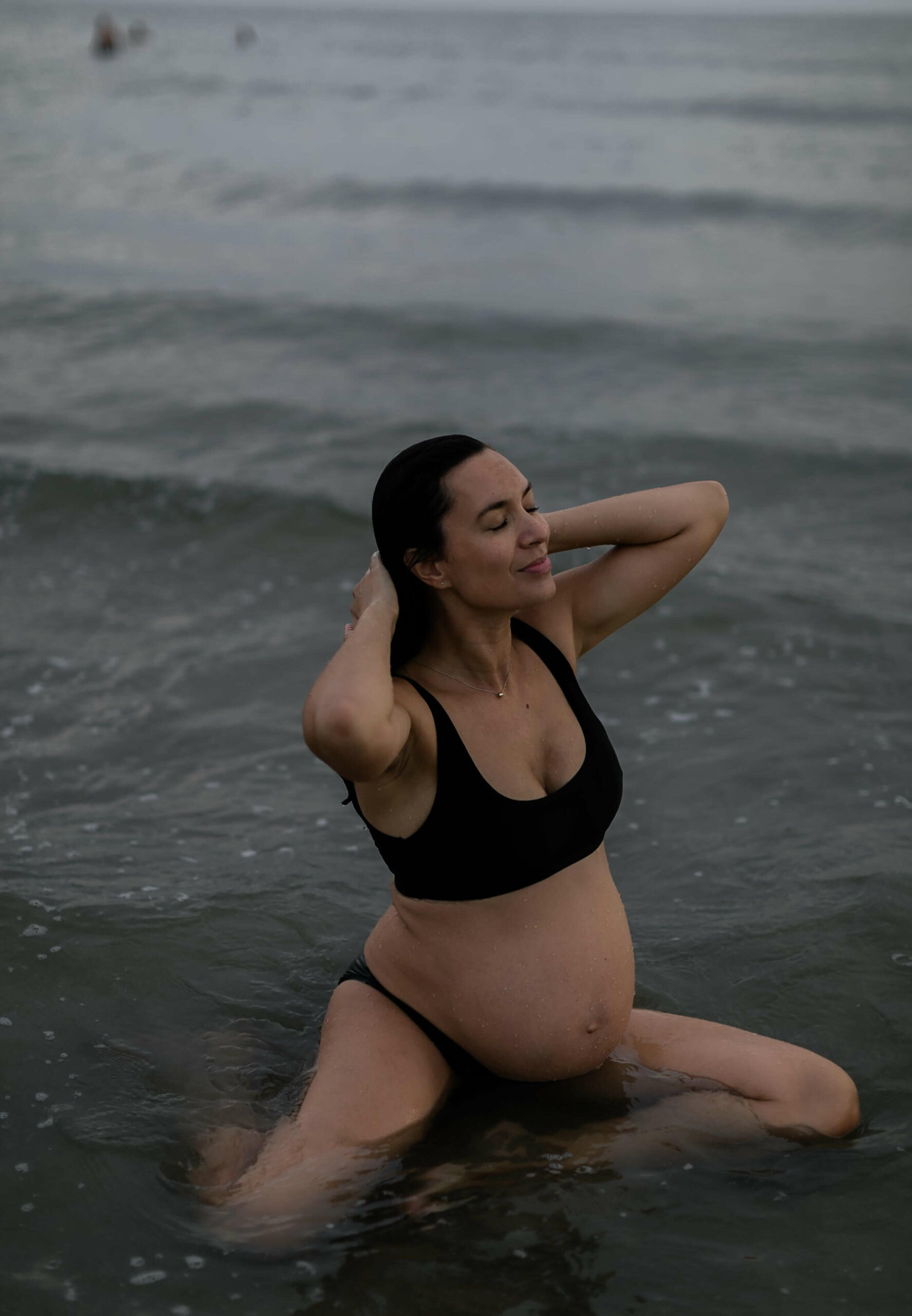 alt="tranquil maternity portrait session at golden hour at the beach Zandvoort, Netherlands"