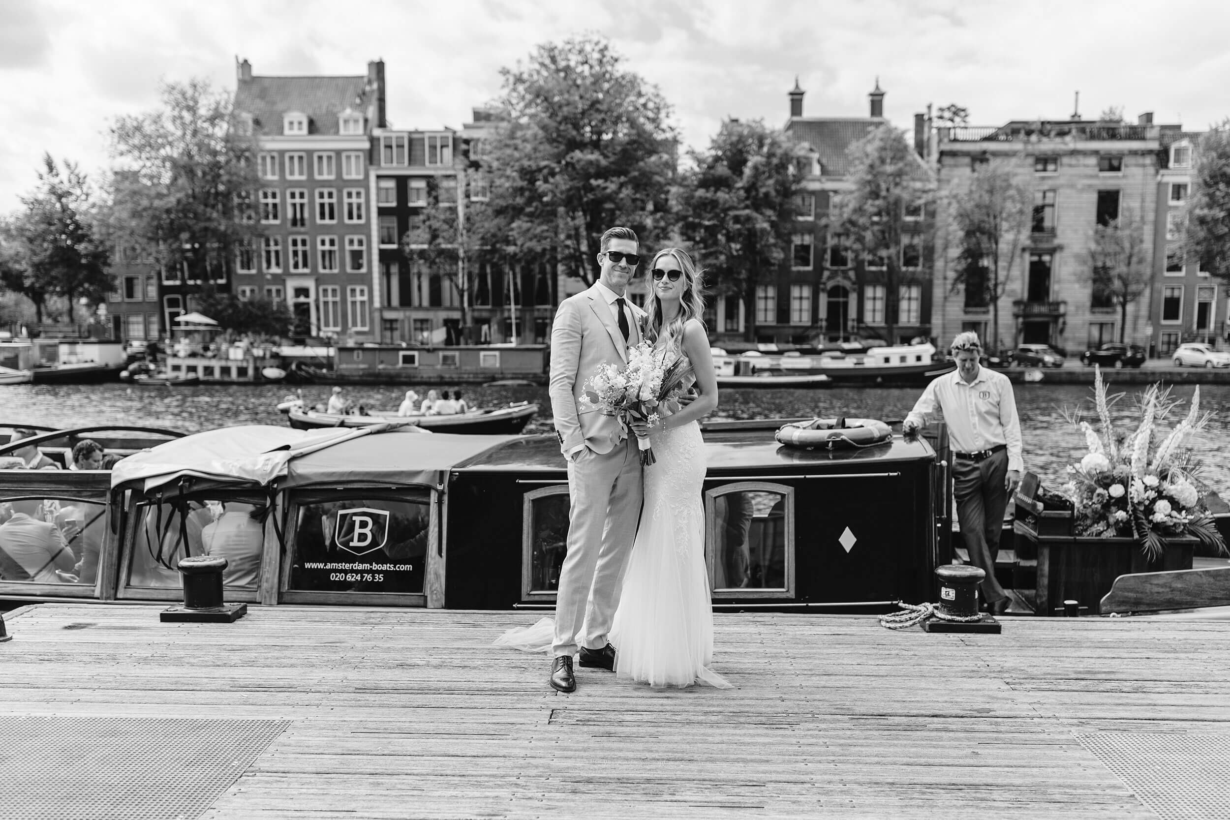 alt="summer wedding river Amstel Amsterdam canal boat cruise bride and groom"